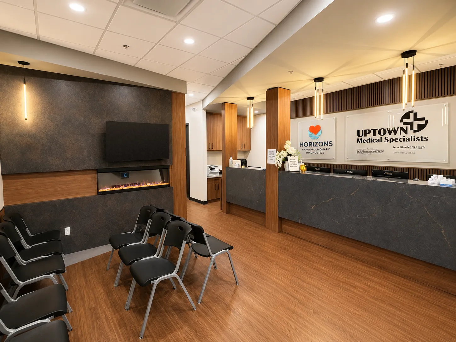 The reception desk in the shared suite, with both clinics signed above it